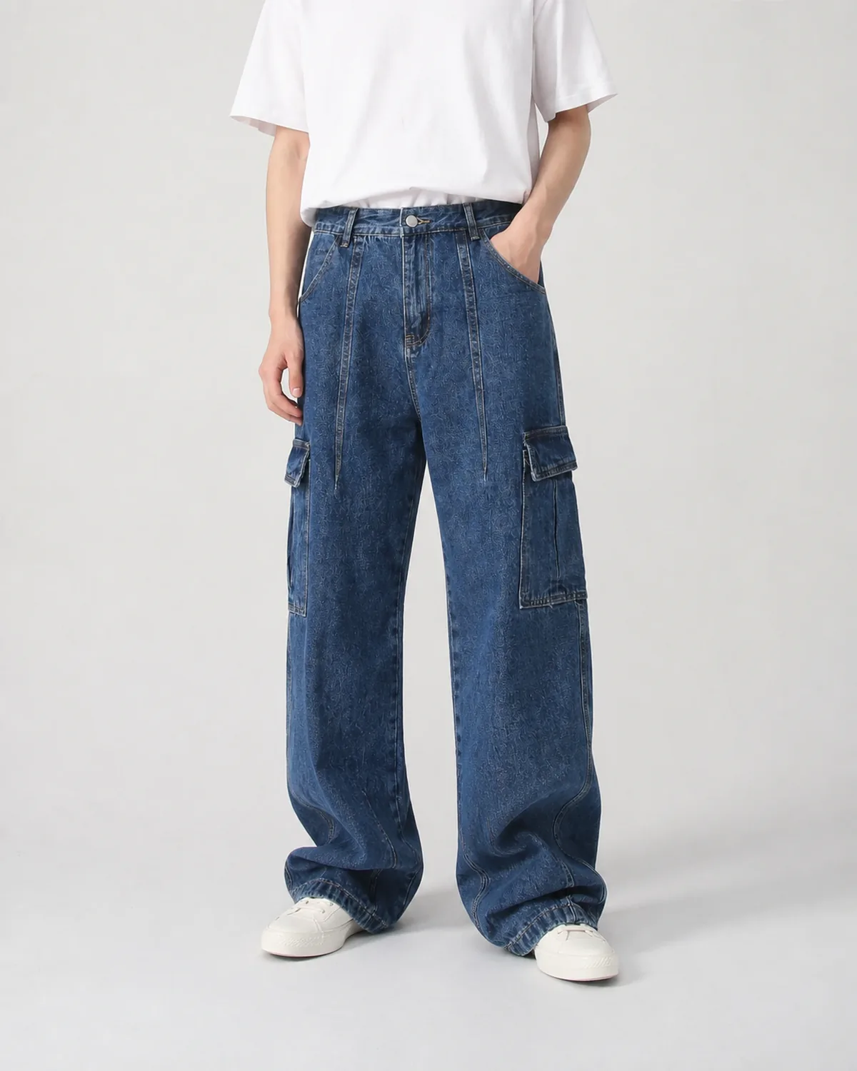 On-body view of men's jeans showing rise and wide leg shape